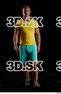 Walking reference of yellow shirt turquoise shorts brown shoes Leland…